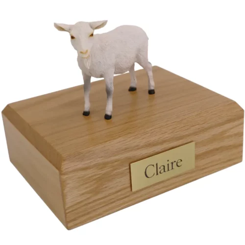 White goat figurine on wood memorial pet cremation urn