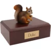 Squirrel figurine on wood memorial pet cremation urn