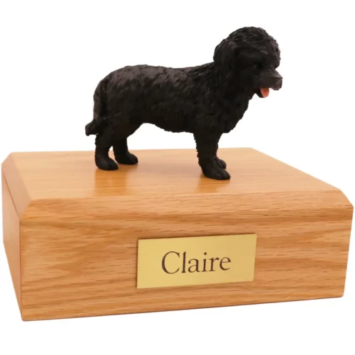 Standing black cockapoo dog figurine on wood memorial pet cremation urn