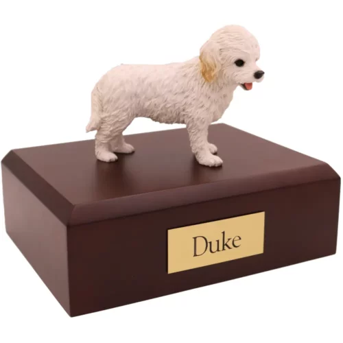 Standing white cockapoo dog figurine on wood memorial pet cremation urn