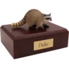 Raccoon figurine on wood memorial pet cremation urn