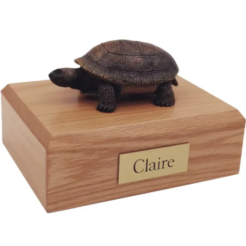 Turtle figurine on wood memorial pet cremation urn