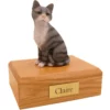 Sitting gray & white cat figurine on wood memorial pet cremation urn
