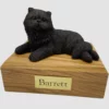 Laying bronze look persian cat figurine on wood memorial pet cremation urn