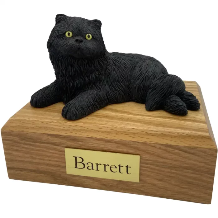 Laying black persian cat figurine on wood memorial pet cremation urn