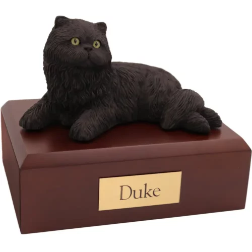 Laying black persian cat figurine on wood memorial pet cremation urn