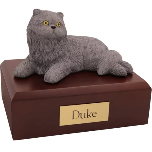 Laying gray persian cat figurine on wood memorial pet cremation urn