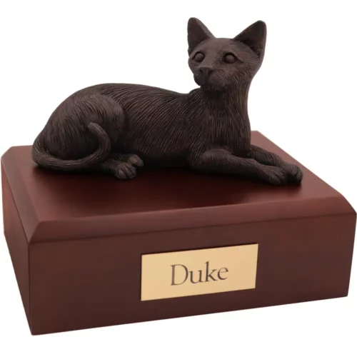 Laying bronze look Siamese cat figurine on wood memorial pet cremation urn