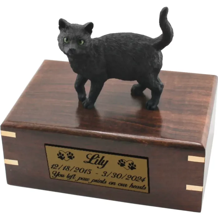 Black shorthaired cat figurine on wood cremation urn, engraved plate