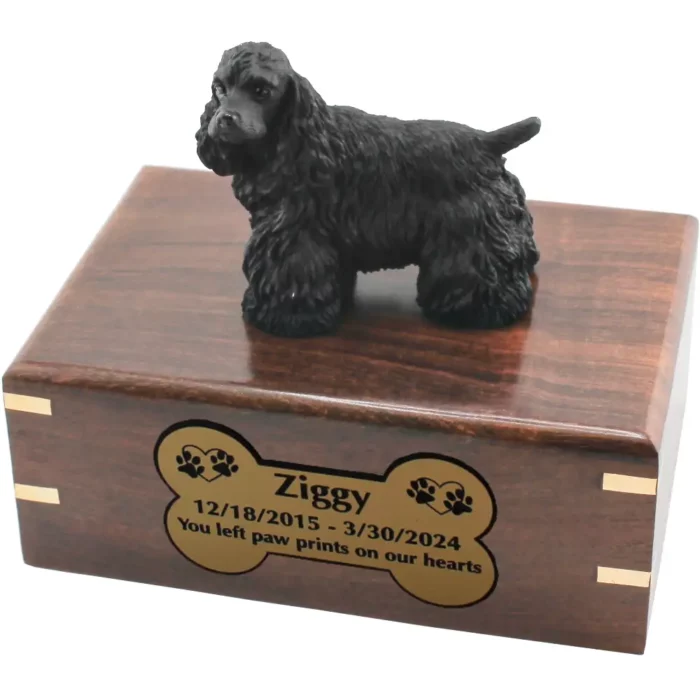 Black cocker spaniel dog figurine on wood cremation urn, engraved plate