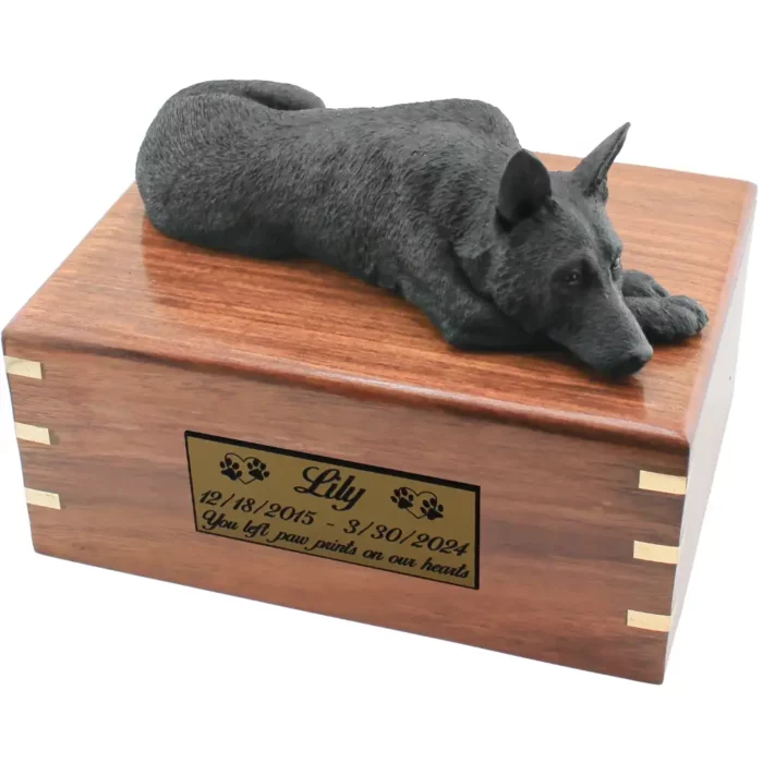 Black german shepherd figurine on wood cremation urn, with engraved plate