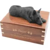 Black german shepherd figurine on wood cremation urn, with engraved wood, gold fill