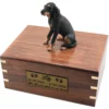 Black & tan coonhound dog figurine on wood cremation urn, engraved plate