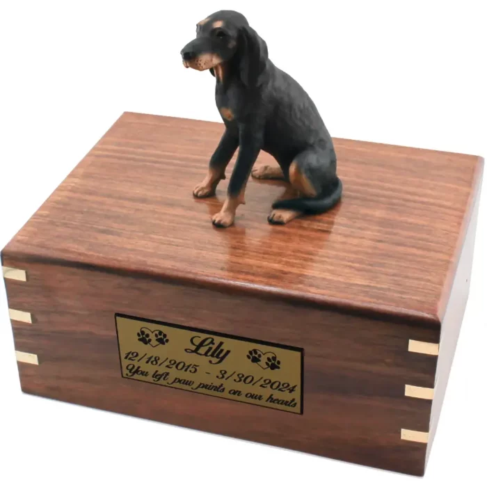 Black & tan coonhound dog figurine on wood cremation urn, engraved plate