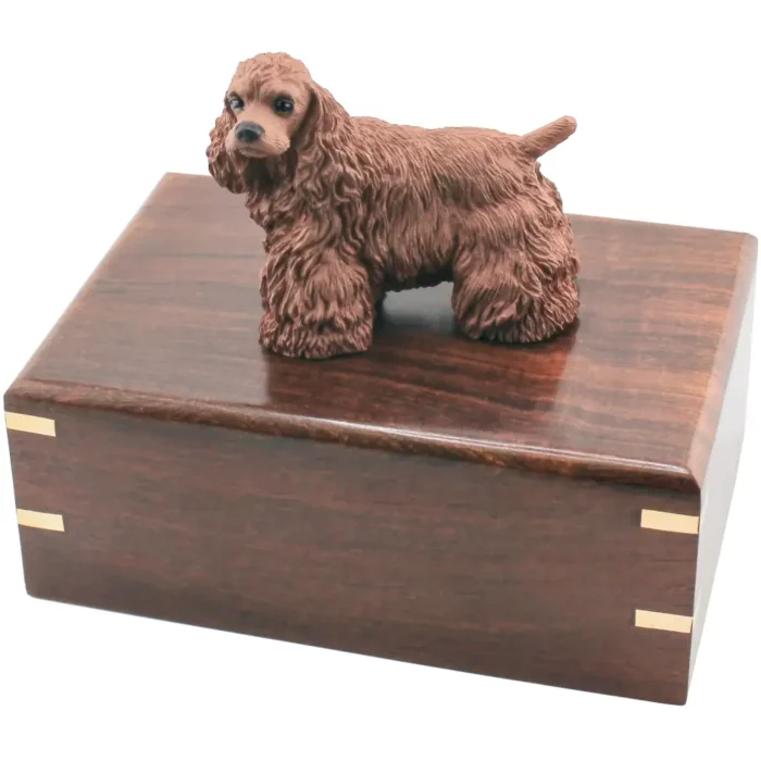 Brown cocker spaniel dog figurine on wood cremation urn
