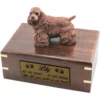 Brown cocker spaniel dog figurine on wood cremation urn, engraved plate