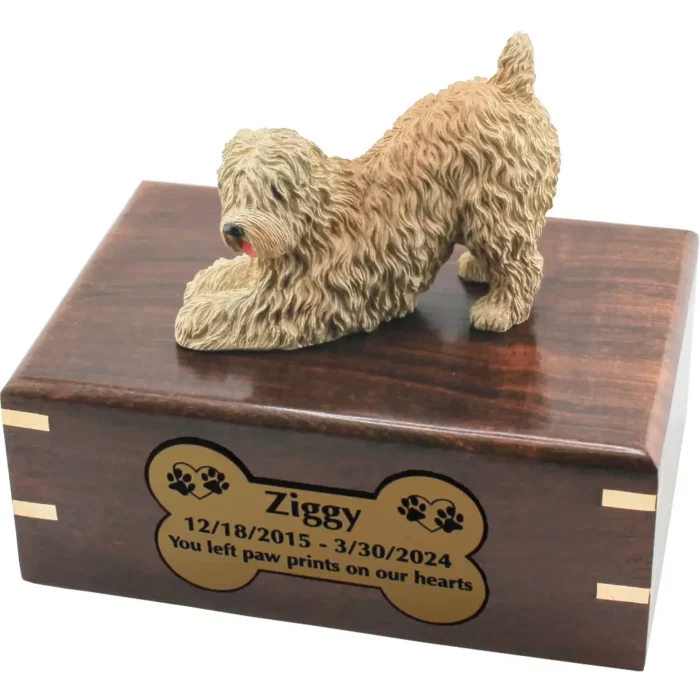Soft coated wheaten dog figurine on wood cremation urn, engraved plate