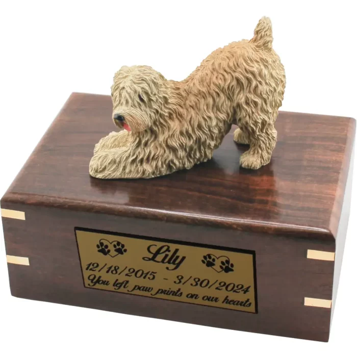 Soft coated wheaten dog figurine on wood cremation urn, engraved plate