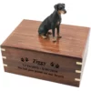 Sitting uncropped black doberman pinscher dog figurine on wood cremation urn, engraved wood, black fill