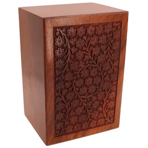 Hand-carved circle of life rosewood pet cremation urn, top view