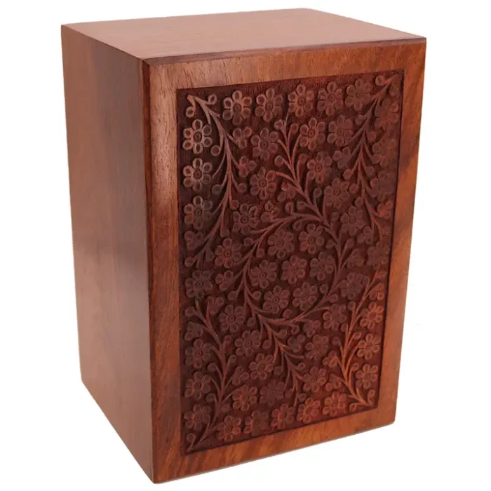 Hand-carved circle of life rosewood pet cremation urn, top view