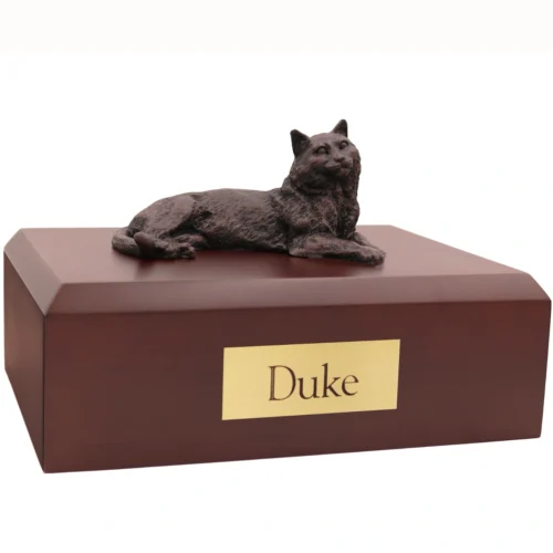 bronze look laying cat figurine on wood cremation urn