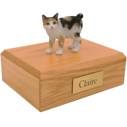Standing tortoise and white Japanese Bobtail cat figurine on wood cremation urn