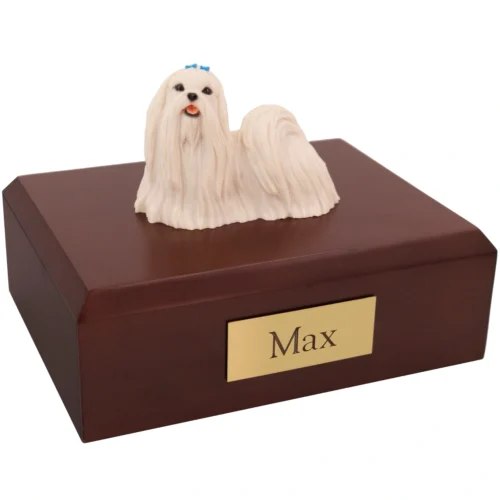 Standing long haired white maltese dog figurine on wood memorial cremation urn