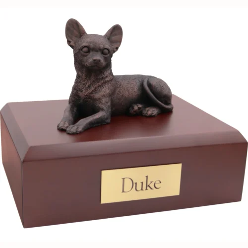 Laying chihuahua bronze look dog figurine on wood cremation urn