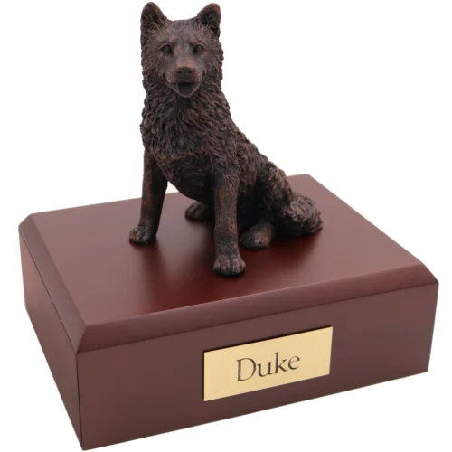 Sitting husky bronze look dog figurine on wood cremation urn