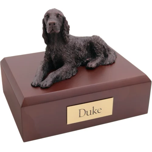 Laying irish setter bronze look dog figurine on wood cremation urn