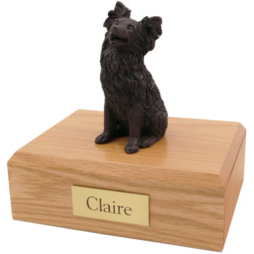 Sitting papillon bronze look dog figurine on wood cremation urn