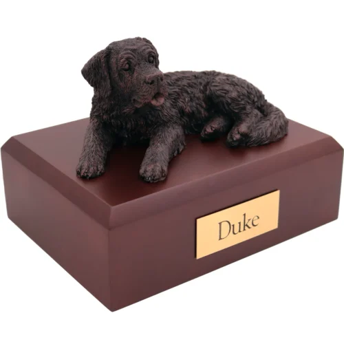Laying saint bernard bronze look dog figurine on wood cremation urn