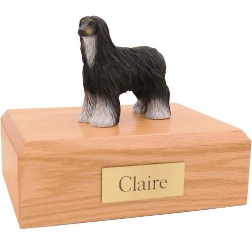 Standing black and white Afghan Hound dog figurine on wood cremation urn
