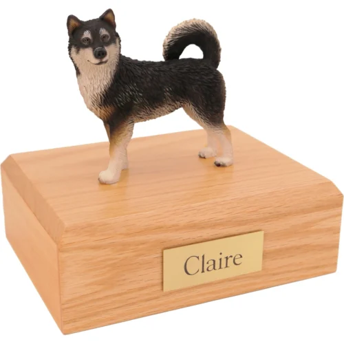 Standing Alaskan Malamute dog figurine on wood cremation urn