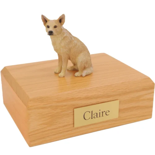 Sitting red australian cattle dog figurine on wood cremation urn