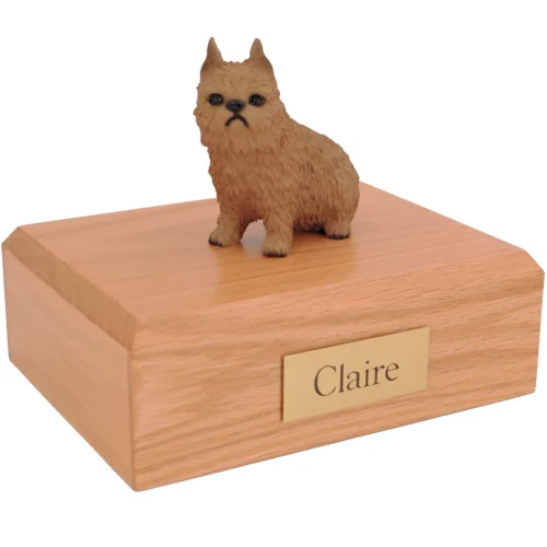 Sitting red Brussels griffon dog figurine on wood cremation urn