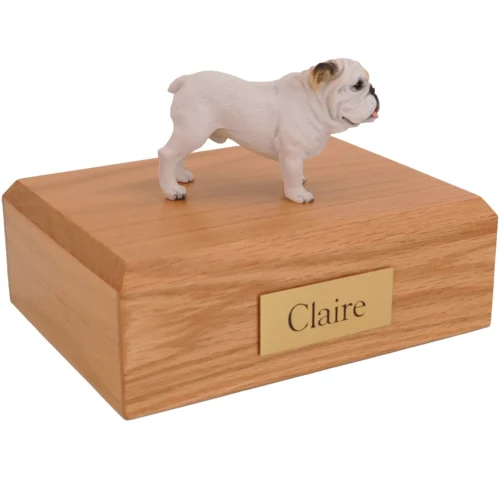 Standing white bulldog dog figurine on wood cremation urn