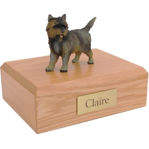 Standing brindle cairn terrier dog figurine on wood cremation urn