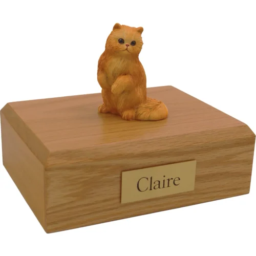 Sitting red persian cat figurine on wood cremation urn