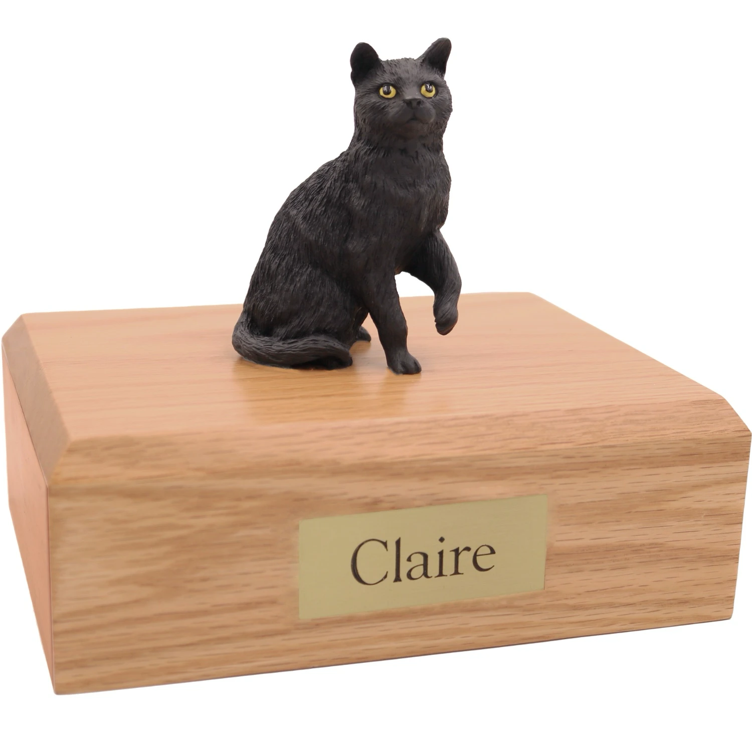 Sitting black shorthaired cat figurine on wood cremation urn
