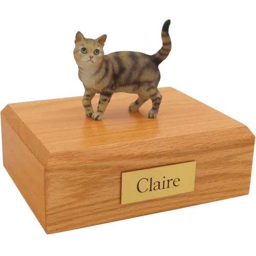 Standing brown shorthair tabby cat figurine on wood cremation urn
