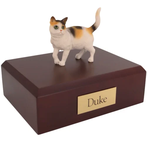 Standing tri color shorthair cat figurine on wood cremation urn