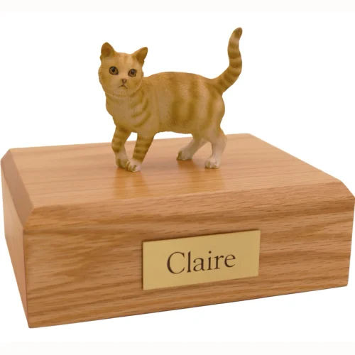 Standing red shorthair tabby cat figurine on wood cremation urn