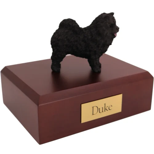 Standing black Chow Chow dog figurine on wood cremation urn
