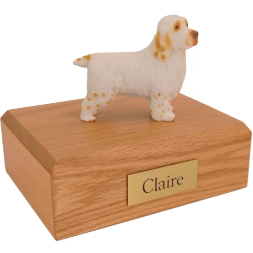 Standing Clumber Spaniel dog figurine on wood cremation urn