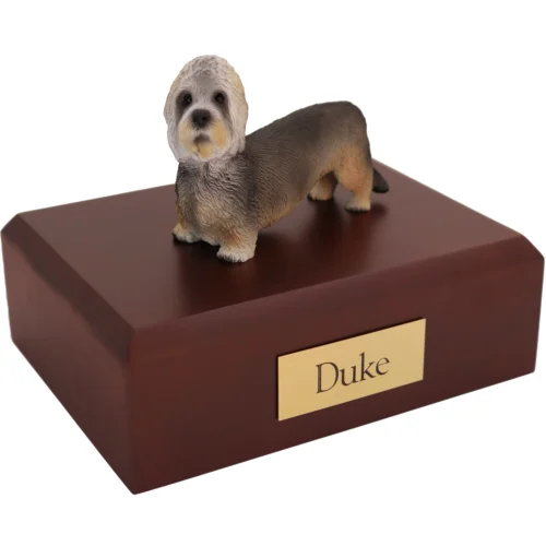 Standing Dandie Dinmont Terrier dog figurine on wood cremation urn