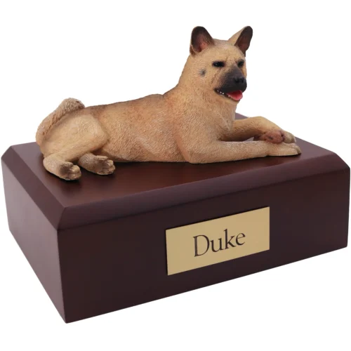 Laying fawn Akita dog figurine on wood cremation urn