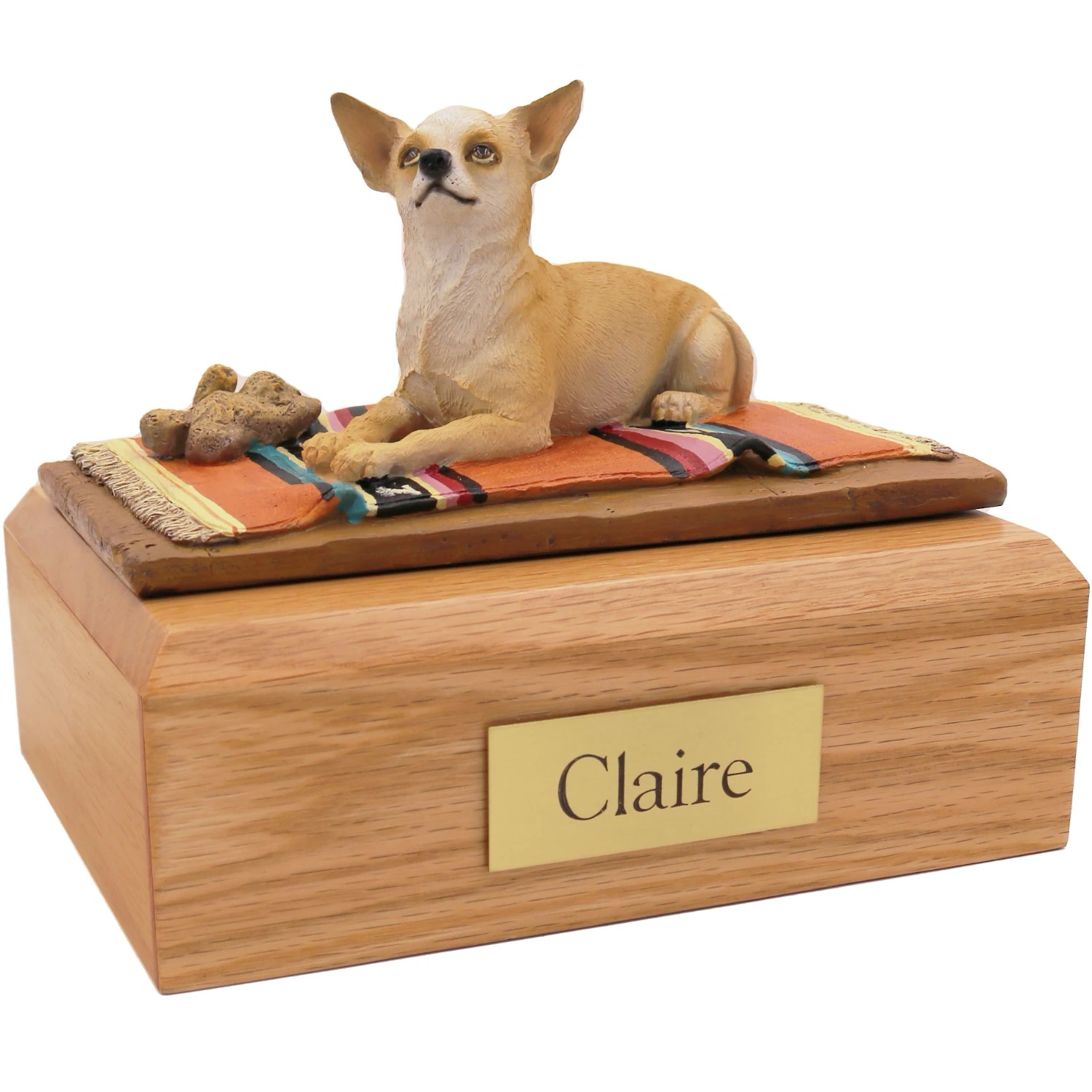 Laying tan and white Chihuahua on rug dog figurine on wood cremation urn