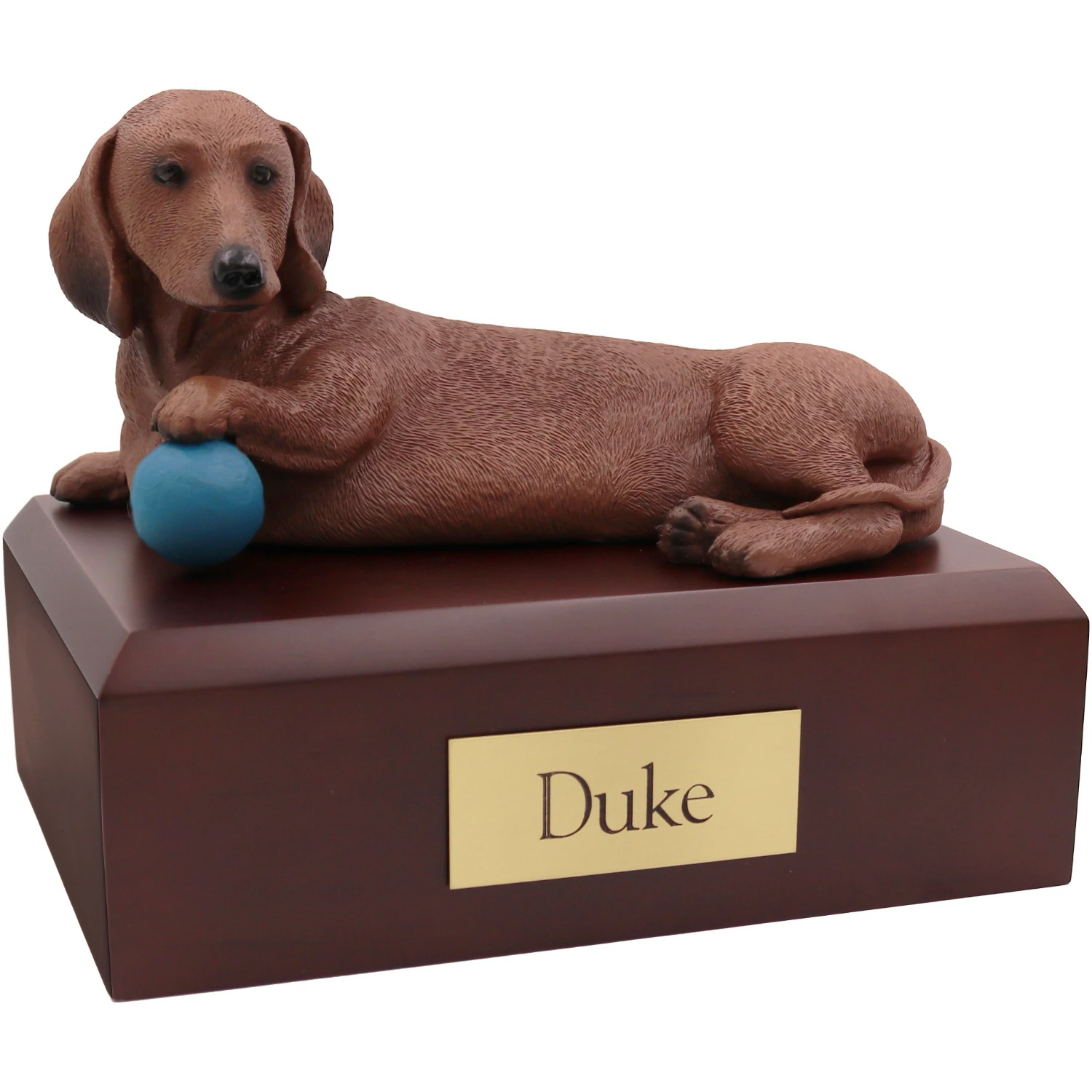 Laying red Dachshund with ball dog figurine on wood cremation urn